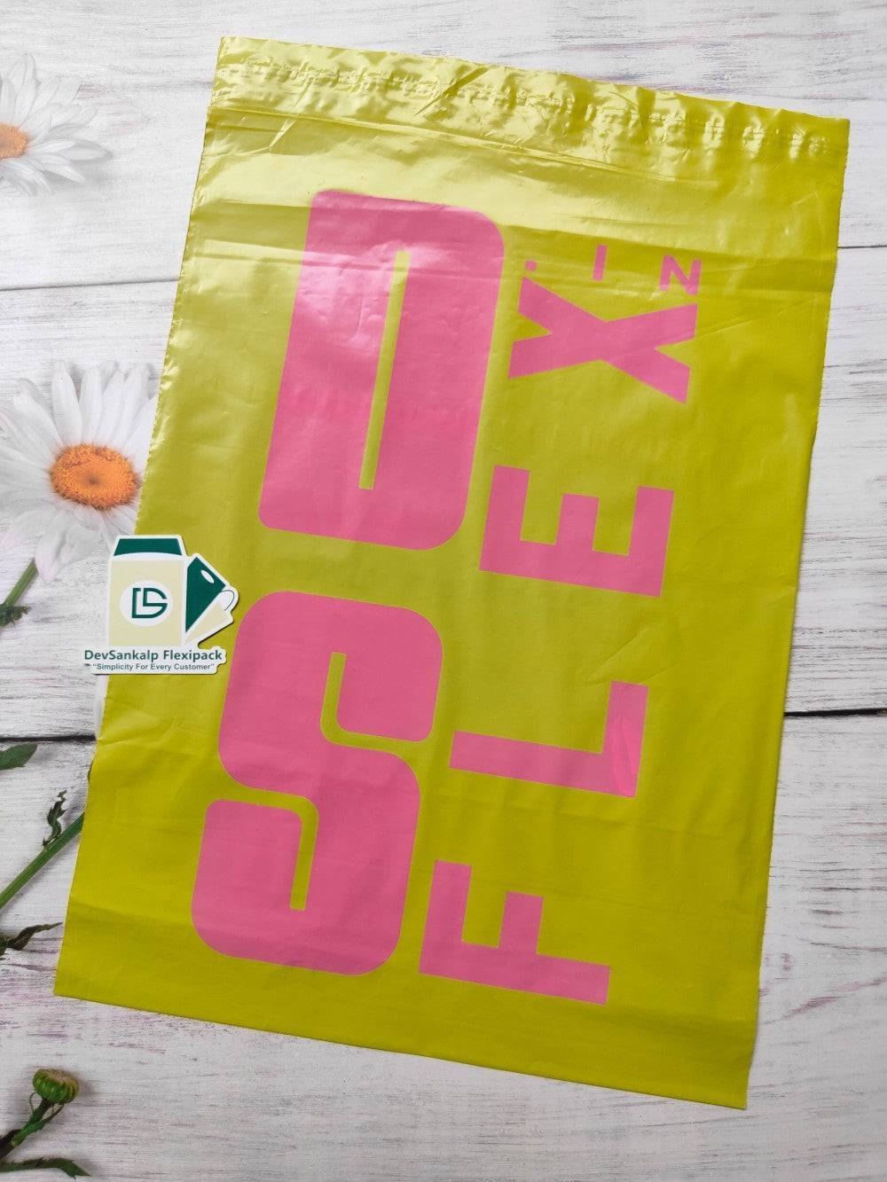 Custom branded yellow courier bag with pink printed branding, designed for stylish and secure product packaging in shipping supplies.