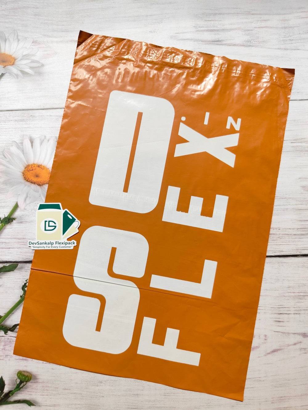 Custom printed orange courier bag with POD, featuring bold white branding. Durable poly mailer ideal for secure shipping and brand visibility.