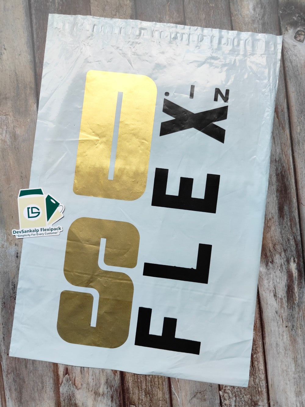 Custom printed courier bag with POD featuring a bold gold and black design for branding. Durable poly mailer ideal for secure shipping and brand visibility.